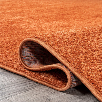 Haze Solid Low-pile Area Rug Orange